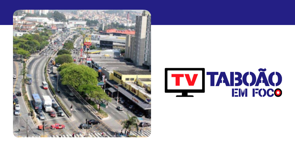 Logo da TV Taboão em Foco ao lado de uma imagem aérea de uma avenida movimentada na cidade de Taboão da Serra.